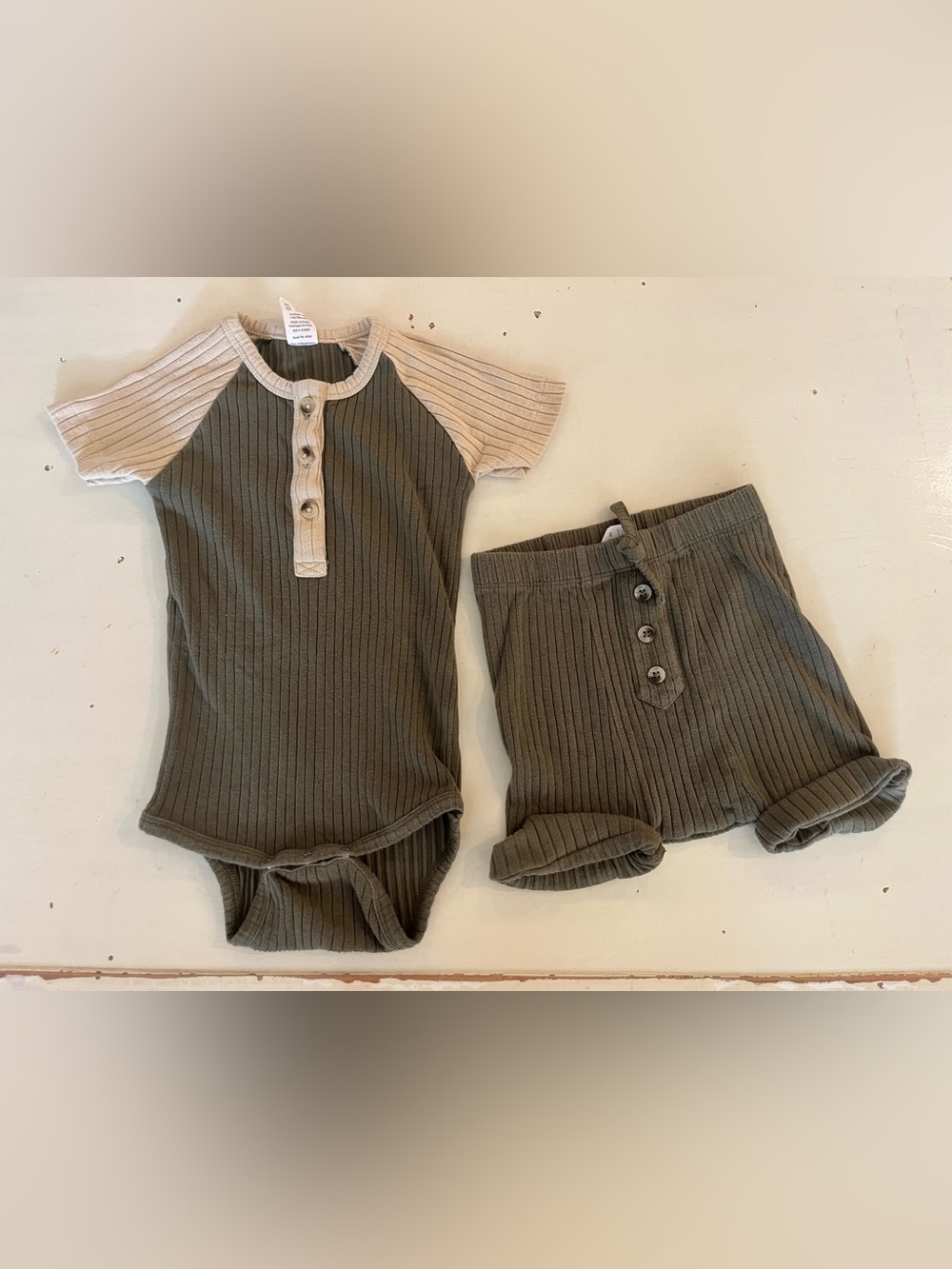 Kate Quinn dark olive bodysuit/short set